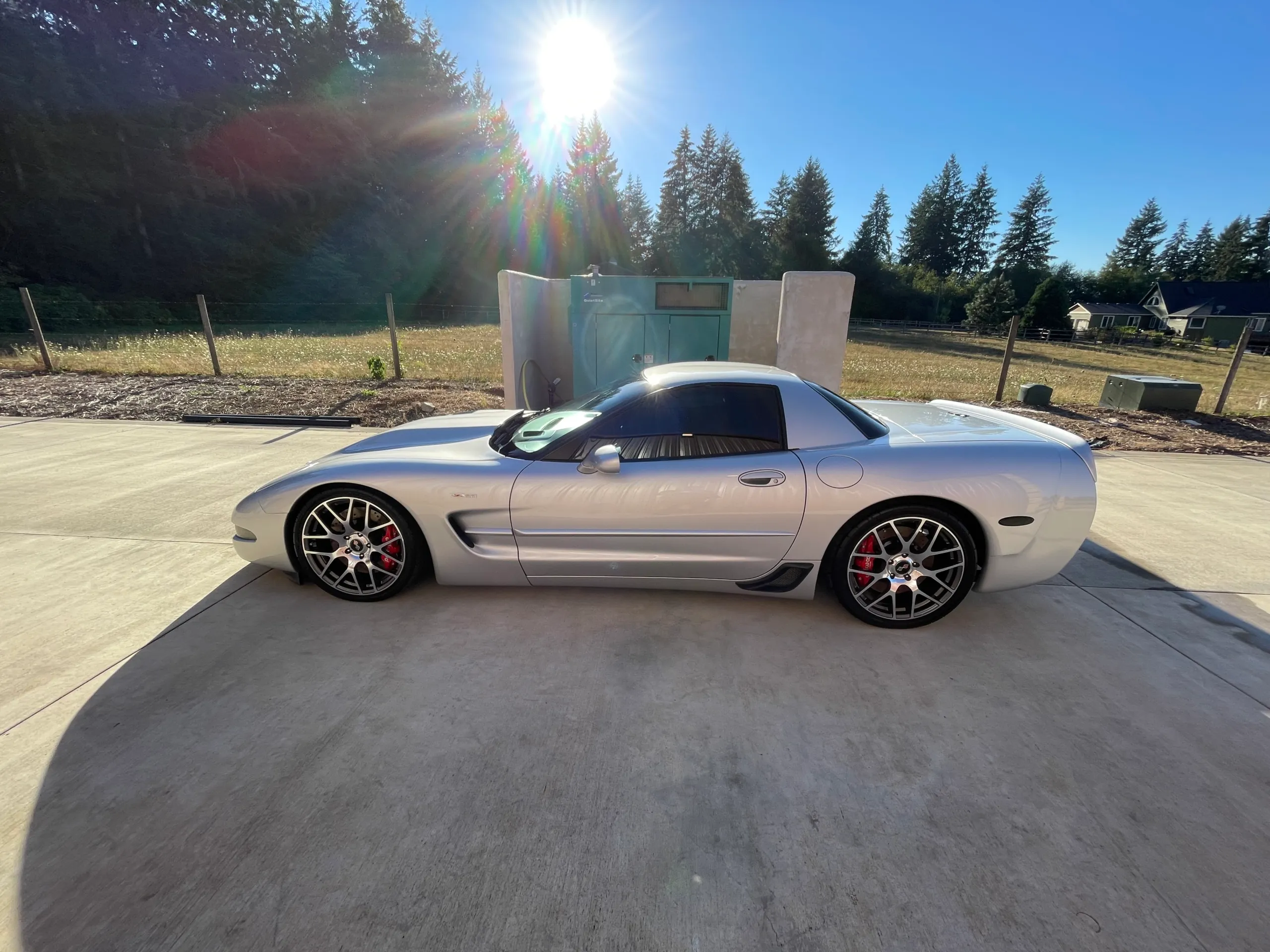 Silver C5 Corvette Z06 outdoors in direct sun after a full exterior detail